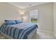 Cozy bedroom featuring a comfortable bed, natural light, and neutral decor at 1431 Evergreen Dr, Greenfield, IN 46140