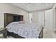 This primary bedroom boasts a ceiling fan, neutral walls, and carpeted floors at 1431 Evergreen Dr, Greenfield, IN 46140