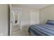 Bedroom with closet and view into another room at 1431 Evergreen Dr, Greenfield, IN 46140