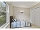 Well-lit bedroom featuring a twin bed with a view from the window and a closet with sliding doors at 1431 Evergreen Dr, Greenfield, IN 46140