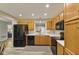 Kitchen with black appliances and wooden cabinets at 1431 Evergreen Dr, Greenfield, IN 46140