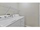 Functional laundry room with modern appliances and shelving at 1431 Evergreen Dr, Greenfield, IN 46140