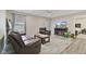 Cozy living room features a leather sofa, a TV, and a decorative fireplace insert at 1431 Evergreen Dr, Greenfield, IN 46140
