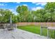 Spacious backyard featuring a gray wood deck, well-maintained lawn, and wood fence for privacy at 14638 Deerwood Dr, Carmel, IN 46033