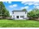 Expansive backyard featuring a well-kept lawn, a deck, a full privacy fence and mature trees providing shade at 14638 Deerwood Dr, Carmel, IN 46033