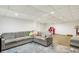 Spacious finished basement with recessed lighting and an L-shaped sofa at 14638 Deerwood Dr, Carmel, IN 46033