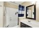 Bright bathroom with a shower-tub combination, a dark vanity, and a mirror at 14638 Deerwood Dr, Carmel, IN 46033