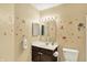 Adorable bathroom featuring a dark-wood vanity, a mirror, and cute baby shark decals for a playful touch at 14638 Deerwood Dr, Carmel, IN 46033