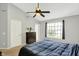 Bright bedroom features vaulted ceilings, a ceiling fan, and a large window with views of the outdoors at 14638 Deerwood Dr, Carmel, IN 46033
