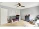 This bedroom features neutral walls, carpet flooring, a ceiling fan, and a grey baby bed at 14638 Deerwood Dr, Carmel, IN 46033