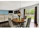 Cozy dining area with a round table, pendant lighting, and view into the living room at 14638 Deerwood Dr, Carmel, IN 46033