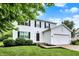 Charming two-story home with a well-manicured lawn and attached two-car garage at 14638 Deerwood Dr, Carmel, IN 46033