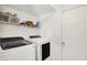 Laundry room features modern appliances and ample storage at 14638 Deerwood Dr, Carmel, IN 46033