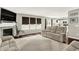 Bright living room featuring cozy seating, a fireplace, and ample natural light at 14638 Deerwood Dr, Carmel, IN 46033