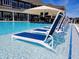 Inviting community pool with in-water seating, lounge chairs, bar, and poolside dining at 1475 Old Hickory Ln, Westfield, IN 46074