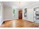 Dining area with hardwood floors, chandelier, and natural light at 1497 Clinton St, Noblesville, IN 46060