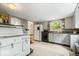 Vintage kitchen with appliances, cabinetry, and bright natural light at 1497 Clinton St, Noblesville, IN 46060