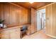Spacious study featuring wood paneling, built-in shelves, and lots of natural light at 1497 Clinton St, Noblesville, IN 46060