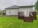 Exterior view of home with wood deck and vinyl siding at 1520 E Kirk St, Muncie, IN 47303