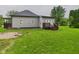 Rear exterior view of house with covered patio at 1520 E Kirk St, Muncie, IN 47303