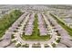 A community of homes lines a street, featuring mature trees and pristine landscaping at 16573 Cava Dr, Fishers, IN 46037