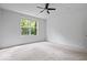 Spacious bedroom with a ceiling fan and a large window providing natural light and outdoor views at 16573 Cava Dr, Fishers, IN 46037