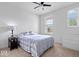 This bedroom features lots of natural light and a cozy bed, dresser and nightstand at 16573 Cava Dr, Fishers, IN 46037