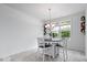 Cozy dining area featuring a round table, decorative lighting, and natural light at 16573 Cava Dr, Fishers, IN 46037