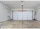 Garage with a clean concrete floor and a white garage door and automatic door opener at 16573 Cava Dr, Fishers, IN 46037
