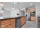 Bright kitchen features stainless steel appliances, granite countertops, and tile flooring at 16573 Cava Dr, Fishers, IN 46037