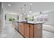 Modern kitchen with a large island, stainless steel dishwasher, and seamless access to the dining area at 16573 Cava Dr, Fishers, IN 46037