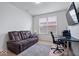 Bright home office features a pull-out couch, desk, TV, and a large window at 16573 Cava Dr, Fishers, IN 46037