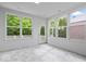 Bright sunroom featuring large windows offering natural light and views to the outside at 16573 Cava Dr, Fishers, IN 46037
