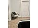 Bedroom chair next to closet doors with neutral paint and carpeting at 1661 S Talbott St, Indianapolis, IN 46225