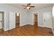 Large bedroom with hardwood floors and neutral paint offers versatile space at 1661 S Talbott St, Indianapolis, IN 46225