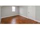 Bedroom features hardwood floors, neutral paint color and natural light at 1661 S Talbott St, Indianapolis, IN 46225