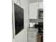Charming kitchen features updated appliances, chalkboard menu, and granite counters at 1661 S Talbott St, Indianapolis, IN 46225