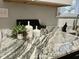 Kitchen counter with marble countertops and decorative vases and bottles at 1661 S Talbott St, Indianapolis, IN 46225