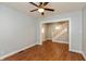 Inviting living room with wood floors, neutral walls, and ceiling fan at 1661 S Talbott St, Indianapolis, IN 46225