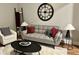 Comfortable living room with grey sofa, accent pillows, and modern decor at 1661 S Talbott St, Indianapolis, IN 46225