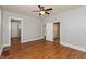 Spacious main bedroom with hardwood floors and multiple doorways at 1661 S Talbott St, Indianapolis, IN 46225