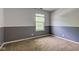 Neutral bedroom with a window that provides natural light and views of lush greenery at 18915 Fairfield Blvd, Noblesville, IN 46060