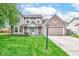 Charming two-story home featuring a well-maintained lawn and inviting front porch at 18915 Fairfield Blvd, Noblesville, IN 46060
