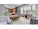 Open-concept living room and kitchen with hardwood floors and a bright bay window at 18915 Fairfield Blvd, Noblesville, IN 46060