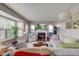 Bright living room with fireplace, large bay windows, hardwood floors, and neutral-toned furniture at 18915 Fairfield Blvd, Noblesville, IN 46060