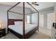 Elegant main bedroom featuring a four-poster bed, soft carpet, and plenty of natural light at 18915 Fairfield Blvd, Noblesville, IN 46060