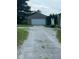 View of detached one car garage accessible via a gravel driveway at 1925 W State Road 32, Lebanon, IN 46052
