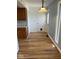 Kitchen featuring hardwood floors, oak cabinets, and white subway tile backsplash at 1925 W State Road 32, Lebanon, IN 46052