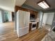 This kitchen features stainless steel appliances and wooden cabinets at 1925 W State Road 32, Lebanon, IN 46052