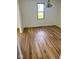Bright living room with beautiful wood-look floors and large window letting in natural light at 1925 W State Road 32, Lebanon, IN 46052